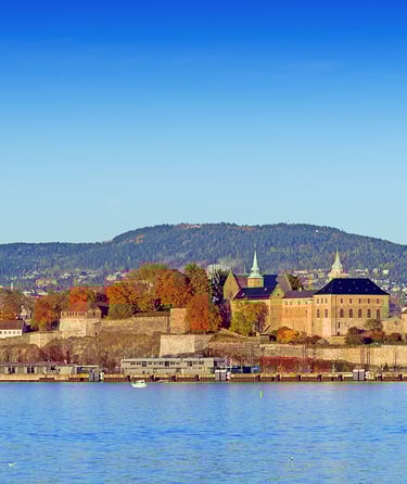 Scenic view of Akershus Fortress in Oslo by the waterfront.