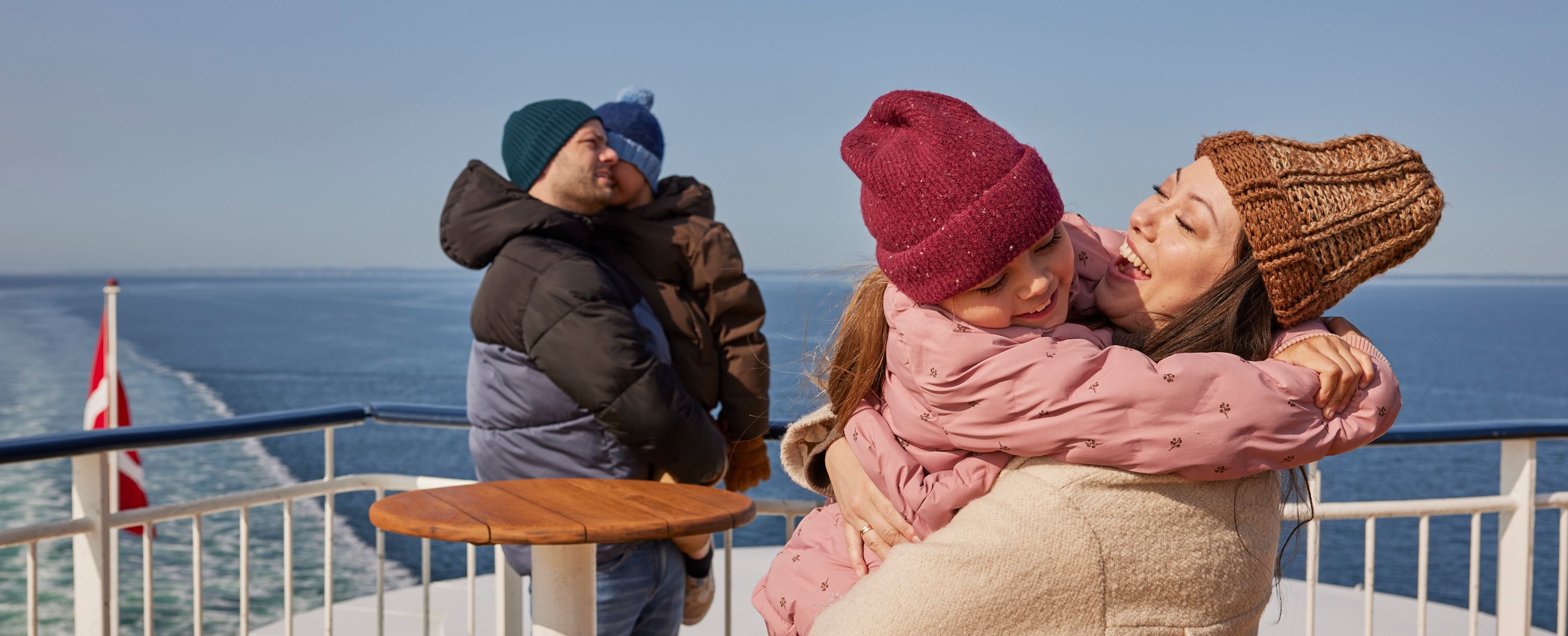 Happy family out on the deck in winter
