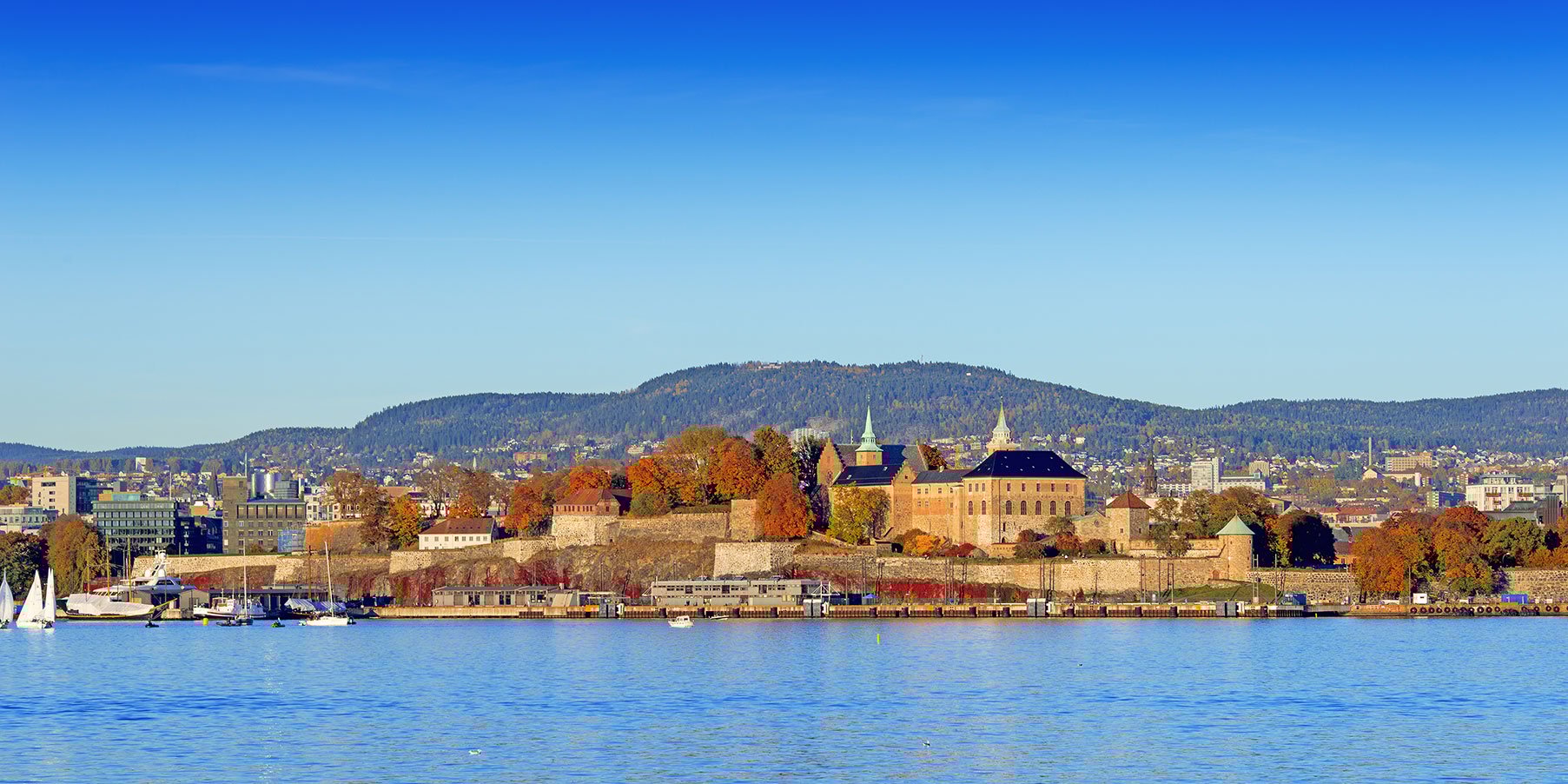 Scenic view of Akershus Fortress in Oslo by the waterfront.