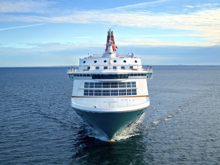 Large passenger ferry sailing on calm blue sea