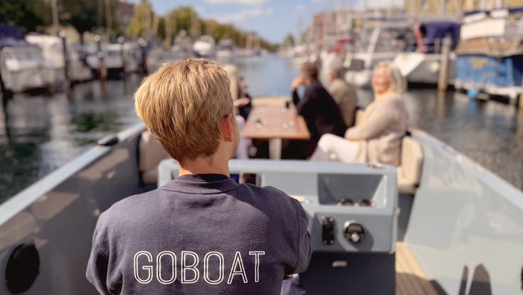 Person driving a boat in Copenhagen