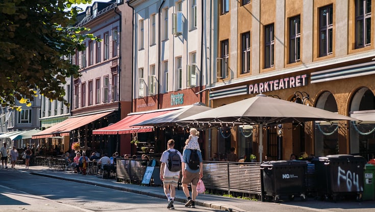 Street scene with cafes and colorful buildings