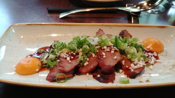 Cooked meat with sauce and garnish served in Oslo.