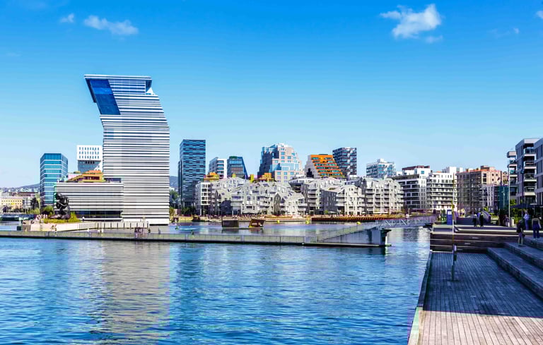 ALT text: Modern waterfront cityscape with a uniquely designed high-rise building