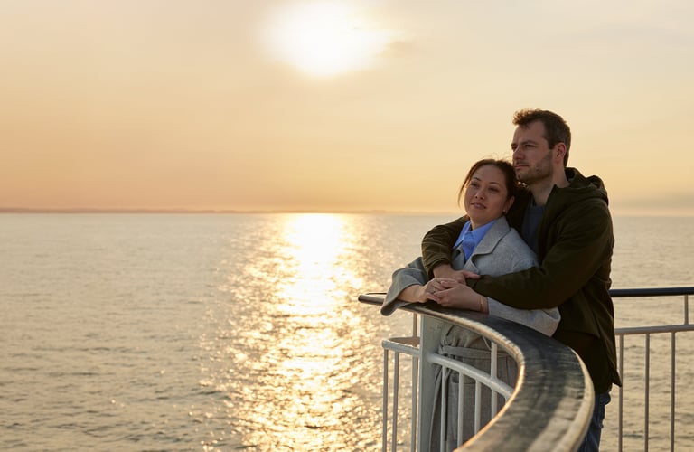 A couple in the sunset on the deck